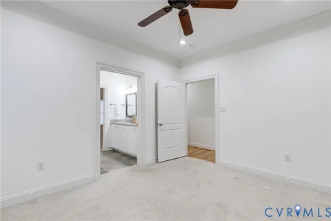 a view of a livingroom with a ceiling fan and window