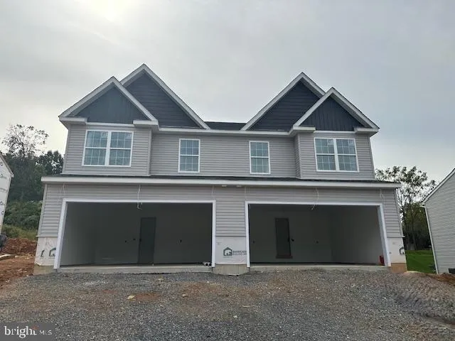 a front view of a house with yard