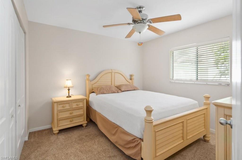 18269 Columbine Road Fort Myers, FL 33967 - Photo 17 of 29 a bed sitting in a bedroom next to a window