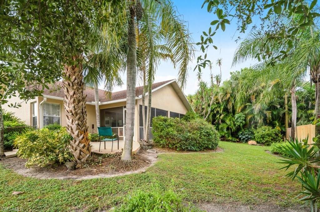 18269 Columbine Road Fort Myers, FL 33967 - Photo 26 of 29 a front view of a house with a yard and tree