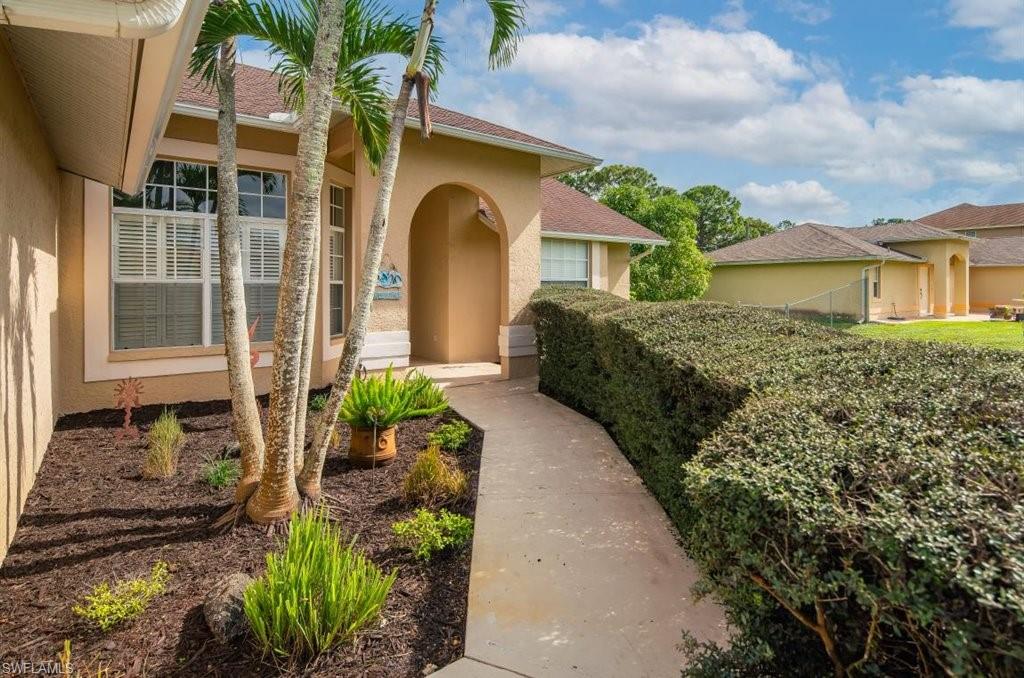 18269 Columbine Road Fort Myers, FL 33967 - Photo 28 of 29 a front view of a house with garden