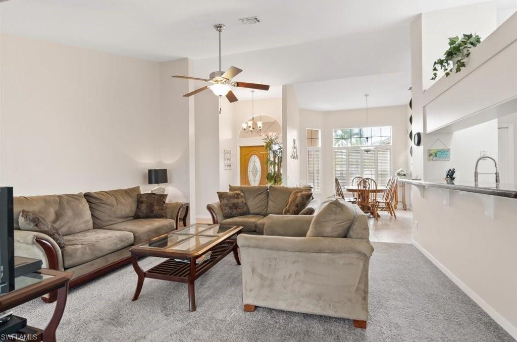 18269 Columbine Road Fort Myers, FL 33967 - Photo 5 of 29 a living room with furniture a ceiling fan and a rug