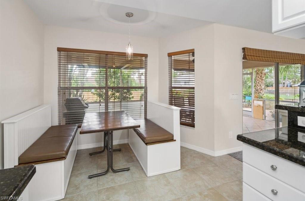 18269 Columbine Road Fort Myers, FL 33967 - Photo 8 of 29 a living room with furniture and floor to ceiling windows
