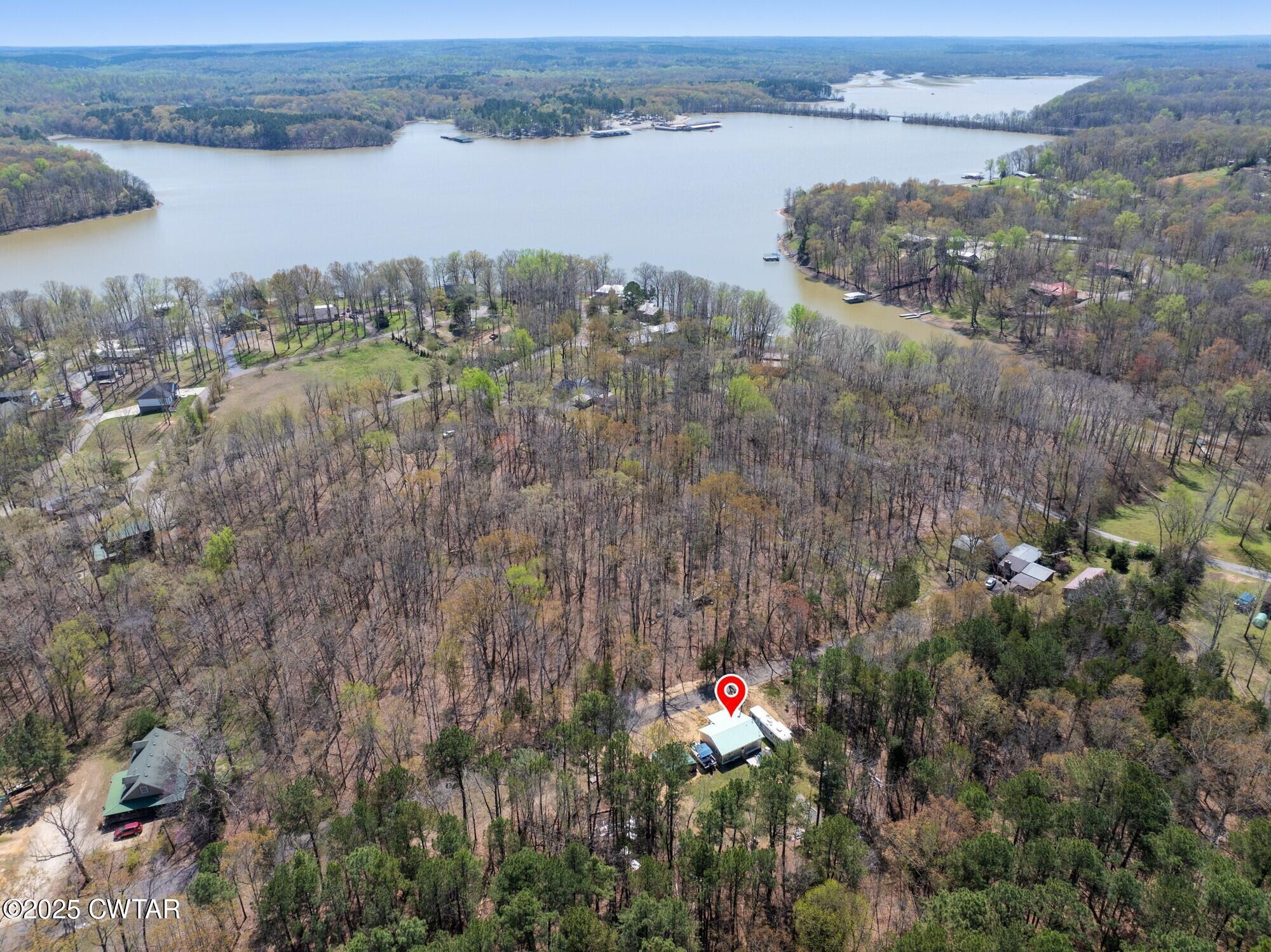 122 Cabin Circle Camden, TN 38320 - Photo 1 of 29 a view of a lake with a city and mountain view