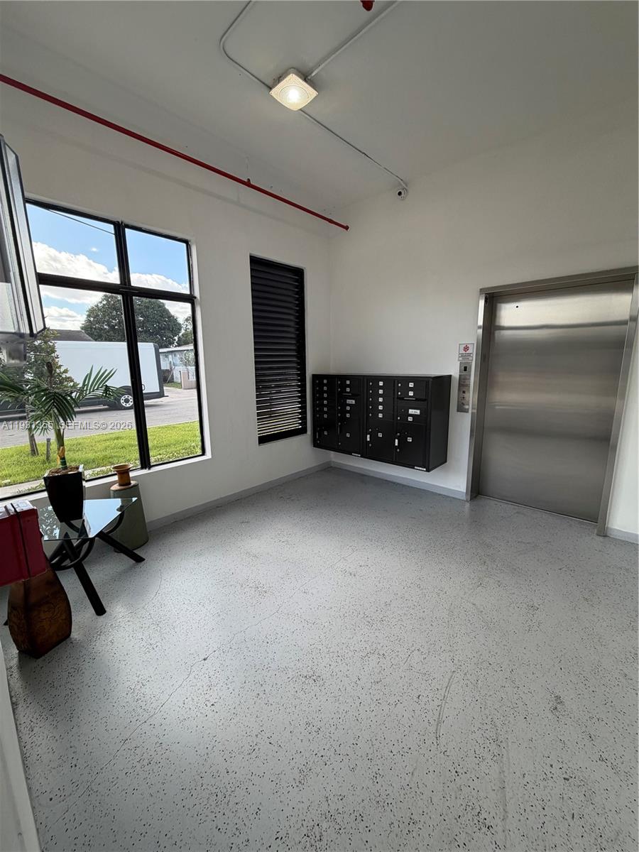853 East 24th Street, Unit 305 Hialeah, FL 33013 - Photo 20 of 20 a view of an empty room with window and furniture