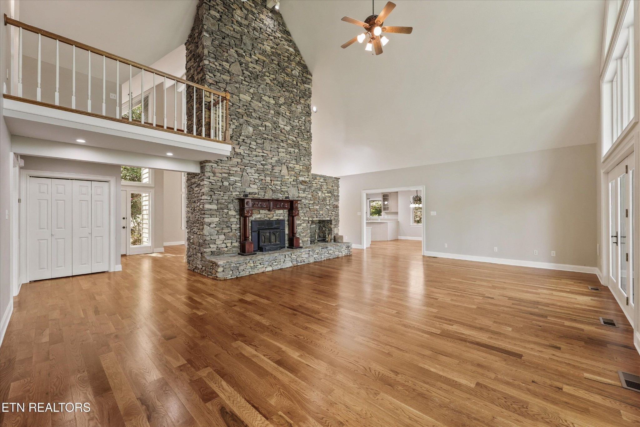865 Stonegate Way Townsend, TN 37882 - Photo 9 of 60 a view of an empty room with wooden floor fireplace and a window