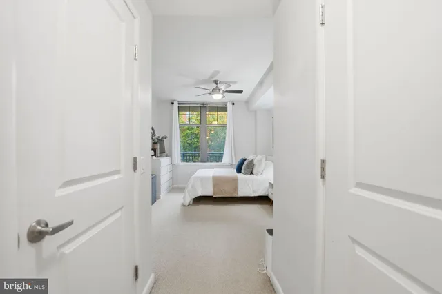 a en suite bathroom with a tub sink and mirror