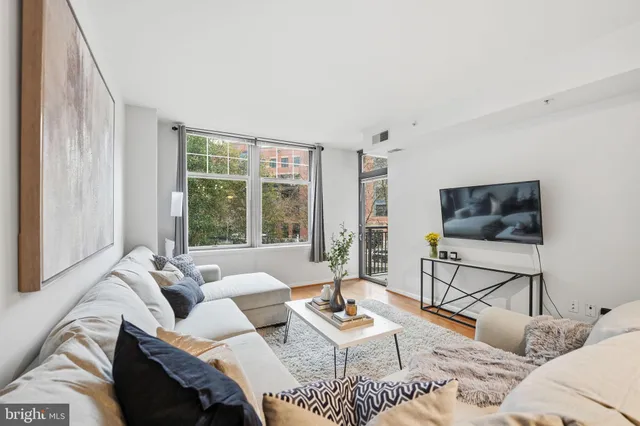 a living room with furniture and a window