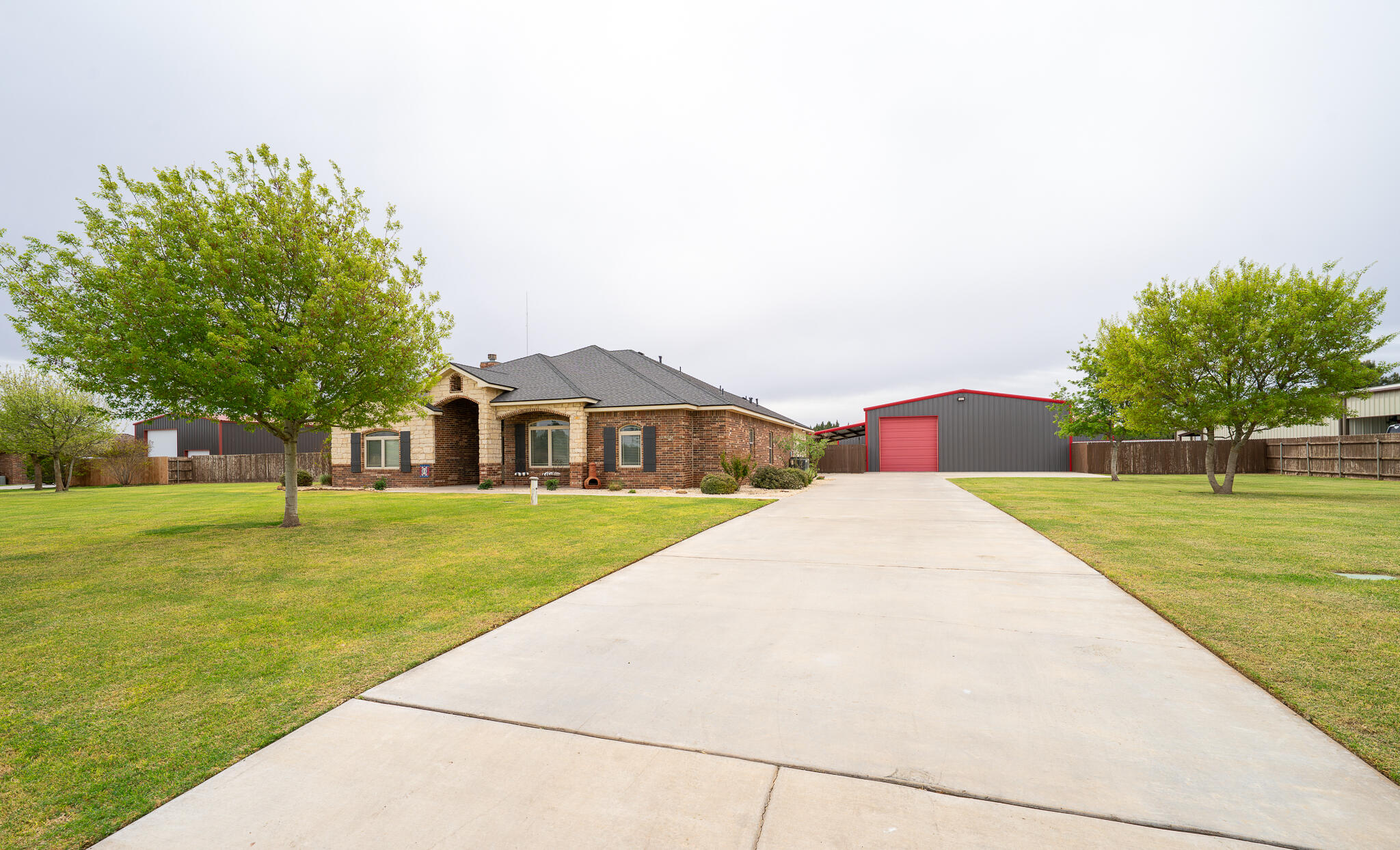3301 County Road 7560 Lubbock, TX 79423 - Photo 2 of 40 a front view of a house with a yard