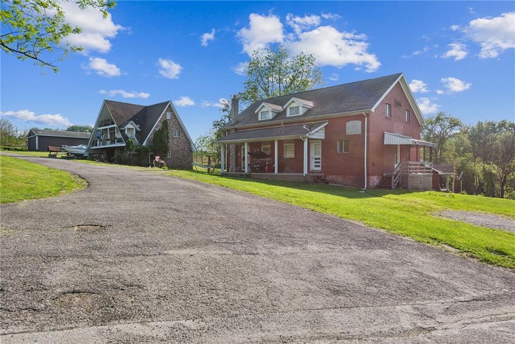 375 Reduction Road Smithton, PA 15479 - Photo 12 of 30 a view of a house with a yard and large tree