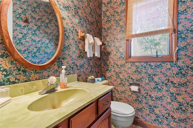 a dining room with furniture water view and a chandelier