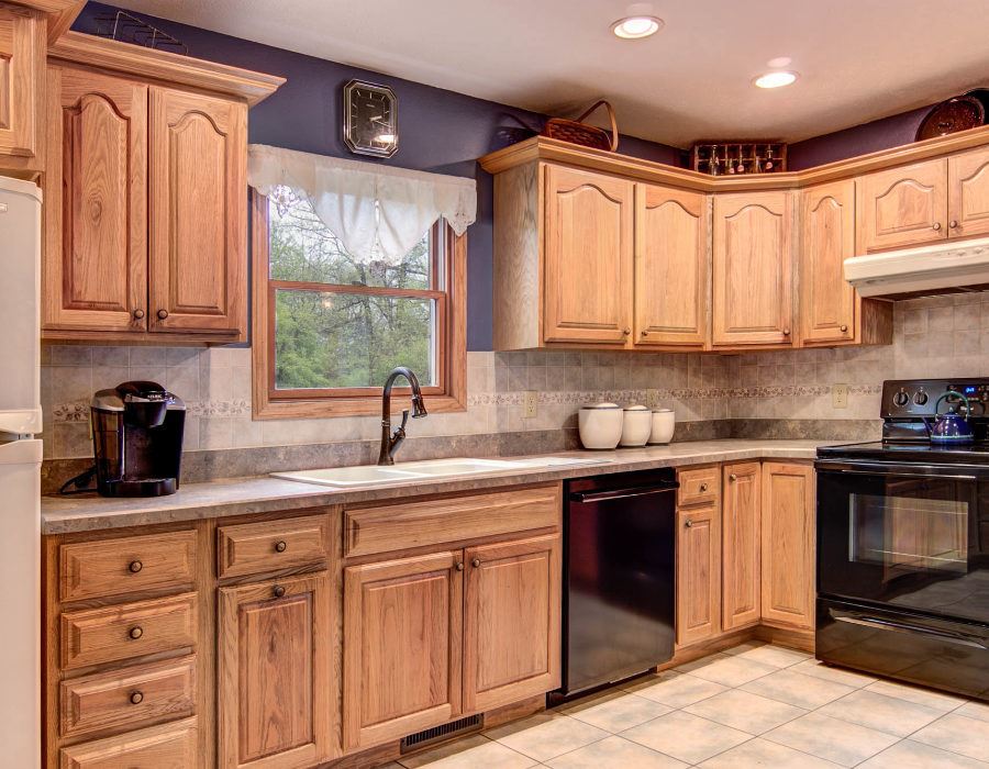 61 North Dakota Road Ridott, IL 61067 - Photo 7 of 25 a kitchen with granite countertop a sink stainless steel appliances and cabinets
