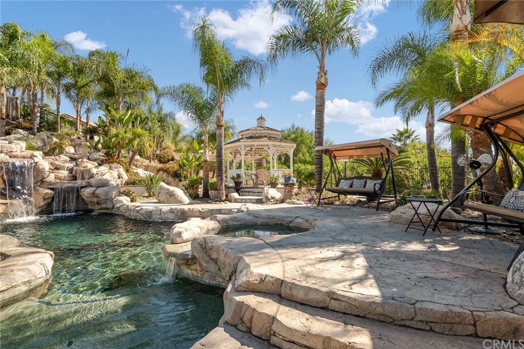 31500 Britton Circle Temecula, CA 92591 - Photo 25 of 68 a view of a swimming pool with a patio and a yard