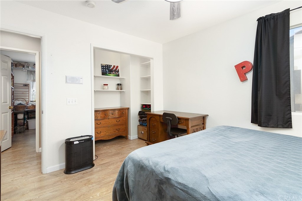 31500 Britton Circle Temecula, CA 92591 - Photo 28 of 68 a bedroom with a bed and wooden floor