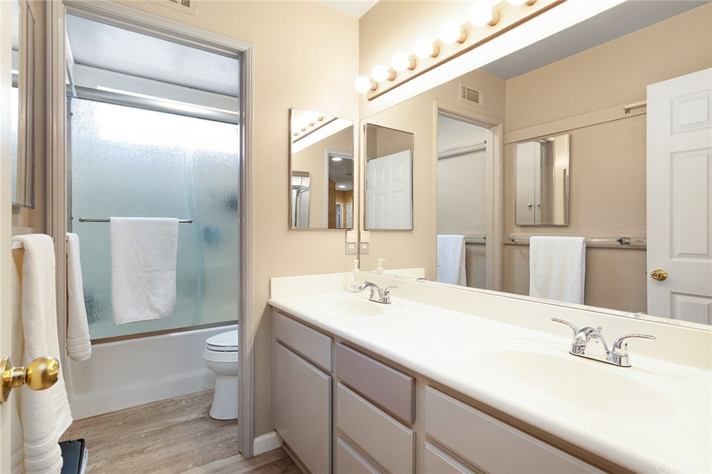 31500 Britton Circle Temecula, CA 92591 - Photo 30 of 68 a bathroom with a double vanity sink mirror and toilet
