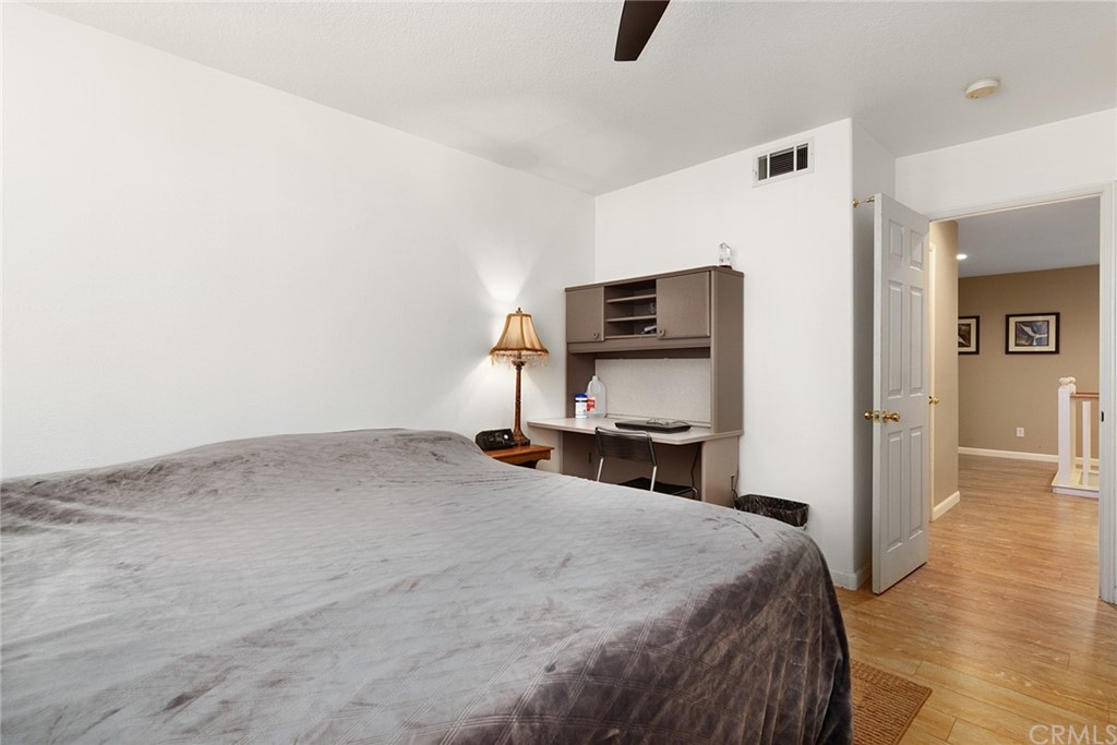 31500 Britton Circle Temecula, CA 92591 - Photo 32 of 68 a bedroom with a bed and a view of bathroom