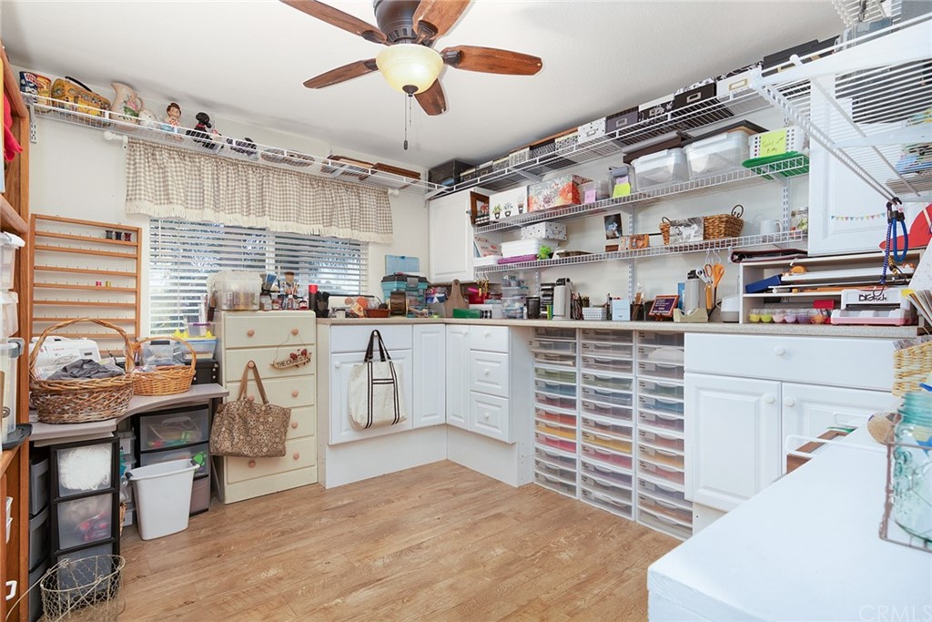 31500 Britton Circle Temecula, CA 92591 - Photo 34 of 68 a kitchen with stainless steel appliances kitchen island granite countertop a sink a stove and a wooden floors