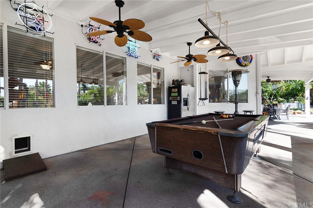 31500 Britton Circle Temecula, CA 92591 - Photo 37 of 68 a kitchen with stainless steel appliances granite countertop a stove and a view of living room