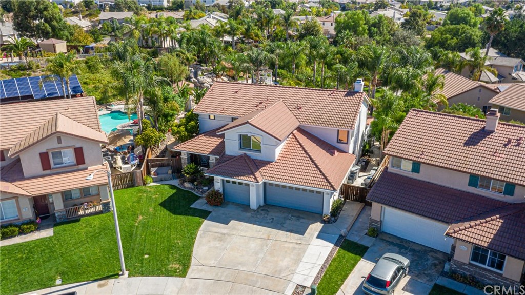 31500 Britton Circle Temecula, CA 92591 - Photo 64 of 68 an aerial view of a house with a yard table and chairs
