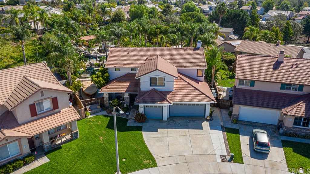 31500 Britton Circle Temecula, CA 92591 - Photo 65 of 68 an aerial view of a house with swimming pool and a yard