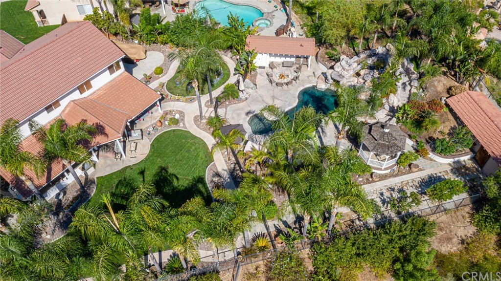 31500 Britton Circle Temecula, CA 92591 - Photo 67 of 68 an aerial view of a house with a garden and trees