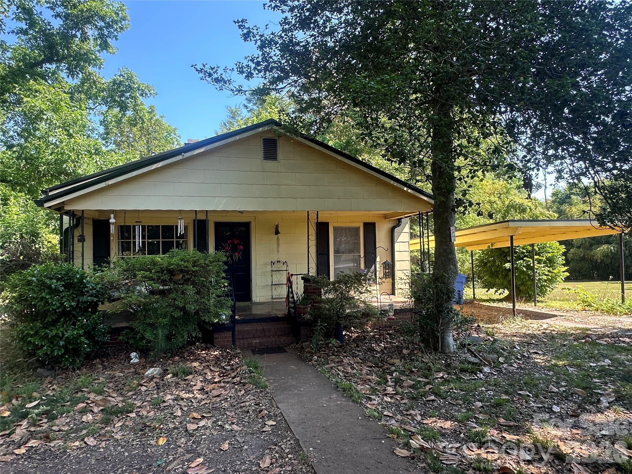 241 Wilson Road Rutherfordton, NC 28139 - Photo 2 of 14 a front view of a house with garden