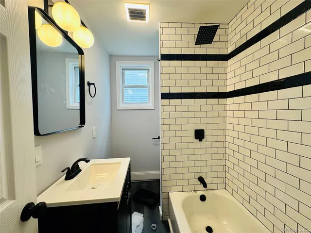 a bathroom with a sink and a bathtub