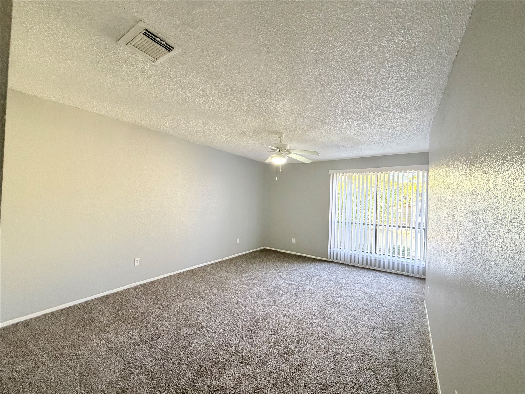 9461 Pagewood Lane, Unit 9461 Houston, TX 77063 - Photo 19 of 33 wooden floor in an empty room with a window