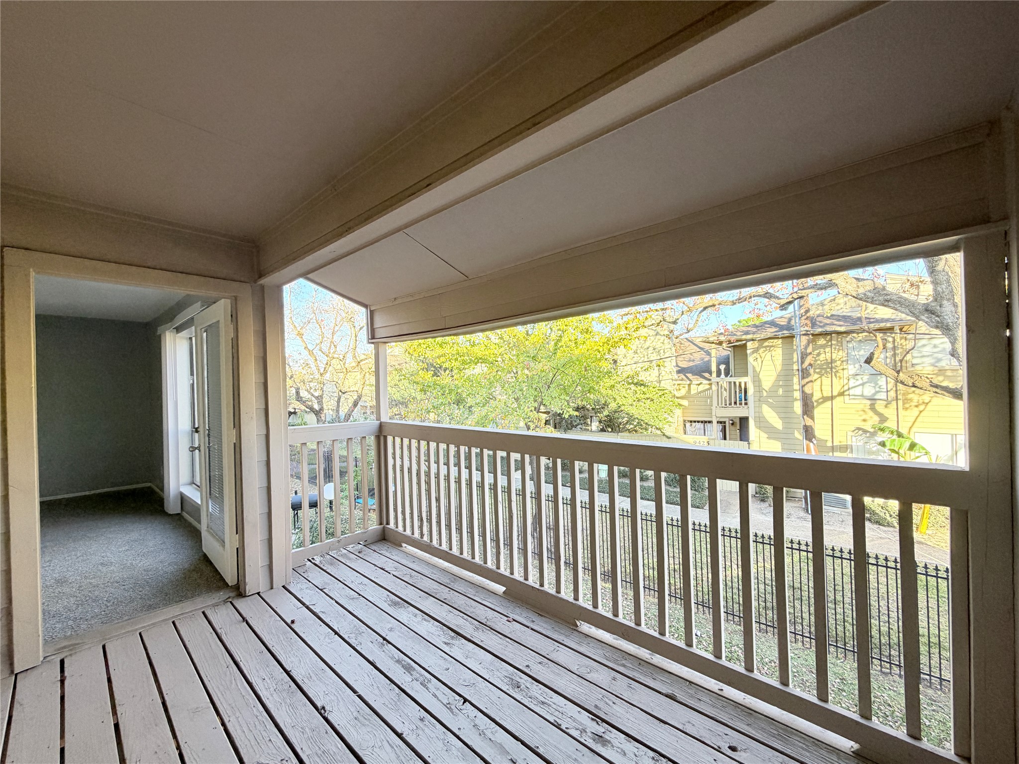 9461 Pagewood Lane, Unit 9461 Houston, TX 77063 - Photo 21 of 33 a view of a balcony with wooden floor