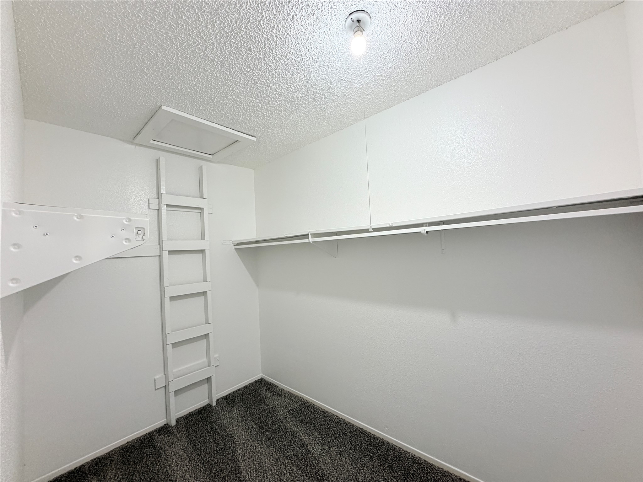 9461 Pagewood Lane, Unit 9461 Houston, TX 77063 - Photo 24 of 33 a view of a room with empty racks