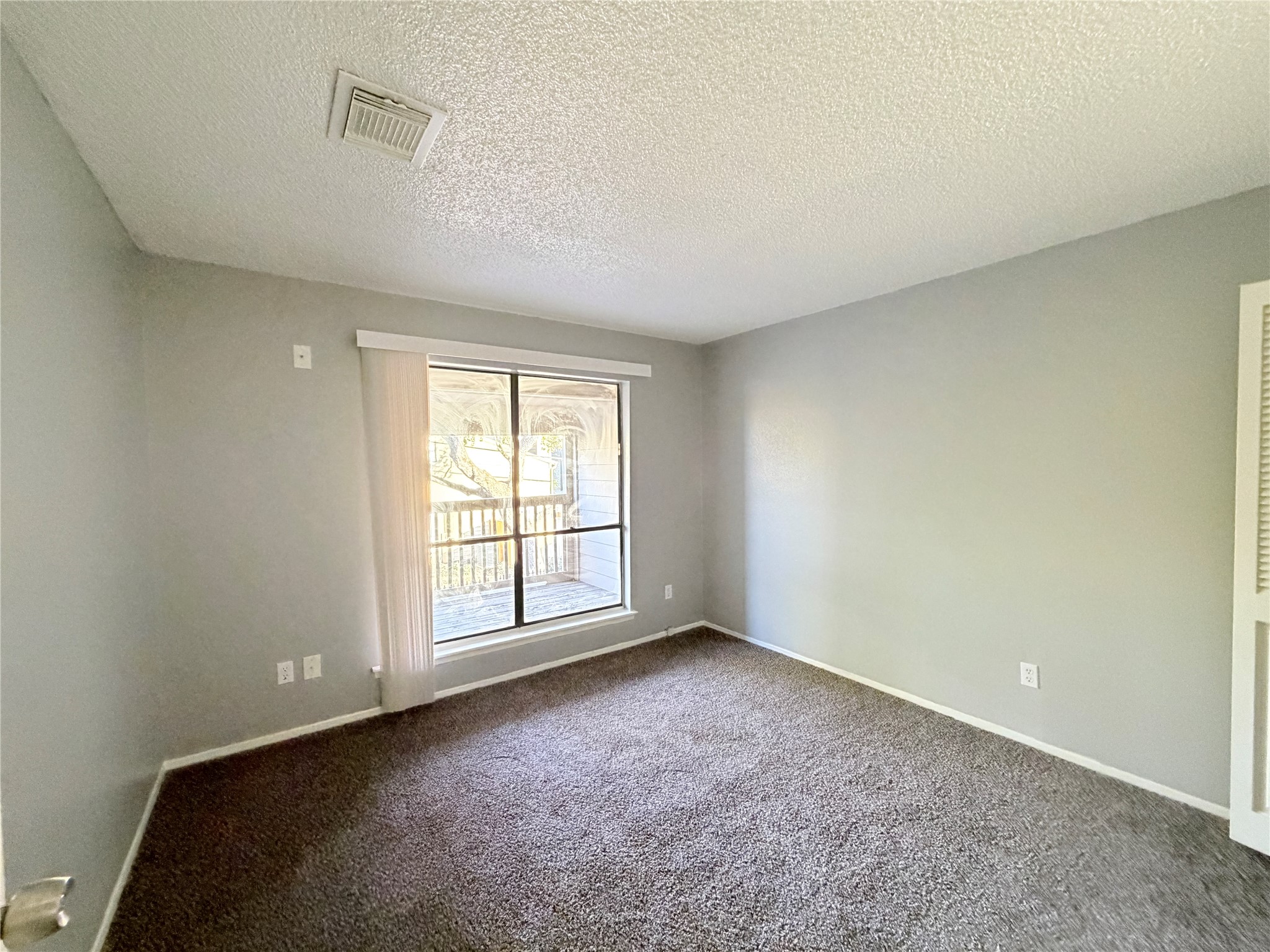 9461 Pagewood Lane, Unit 9461 Houston, TX 77063 - Photo 27 of 33 an empty room with windows
