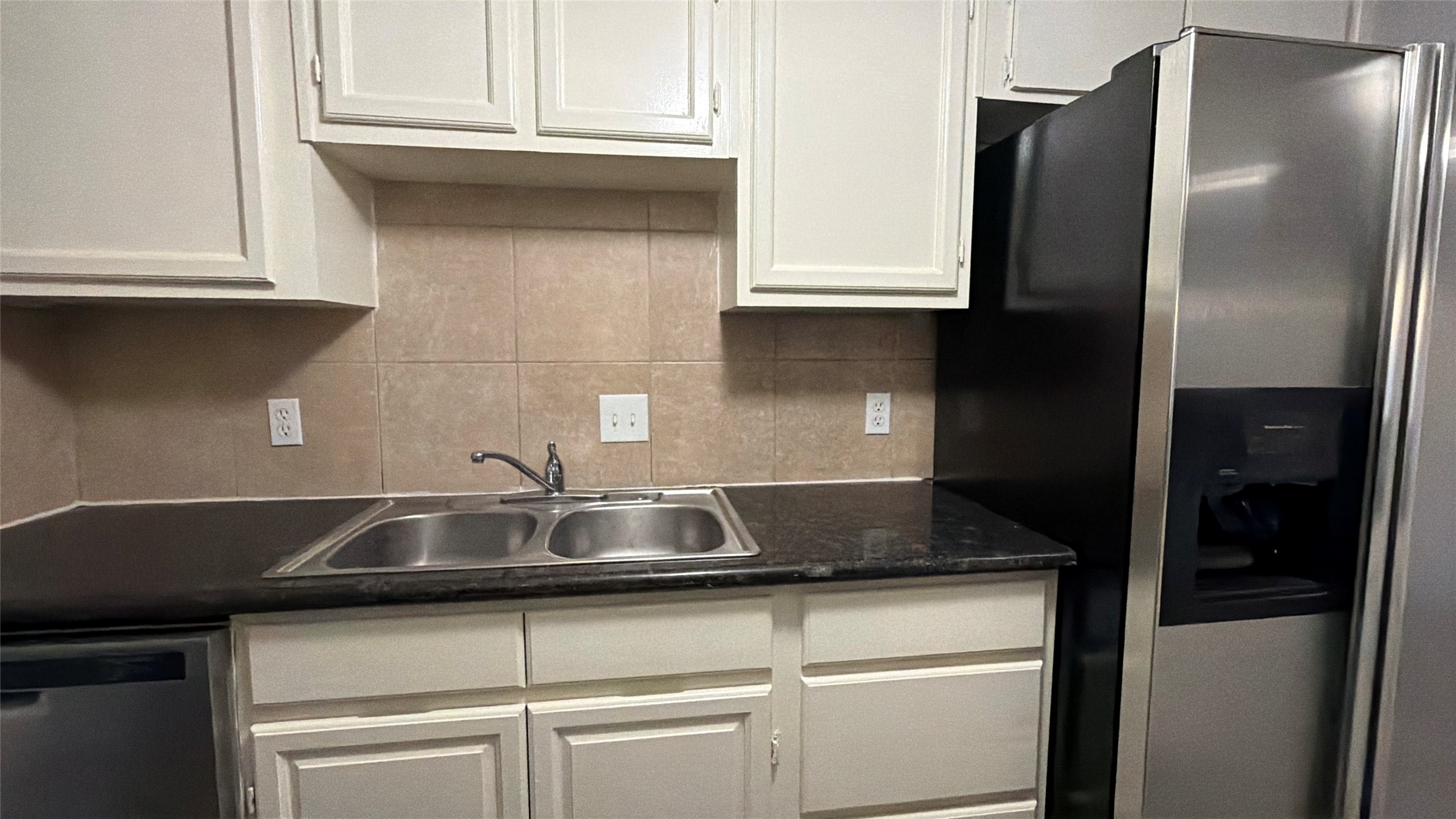 9461 Pagewood Lane, Unit 9461 Houston, TX 77063 - Photo 10 of 33 a kitchen with a sink and cabinets
