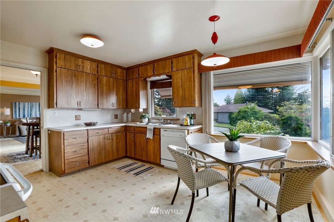 443 View Ridge Drive Everett, WA 98203 - Photo 16 of 35 a kitchen with a table chairs sink and cabinets