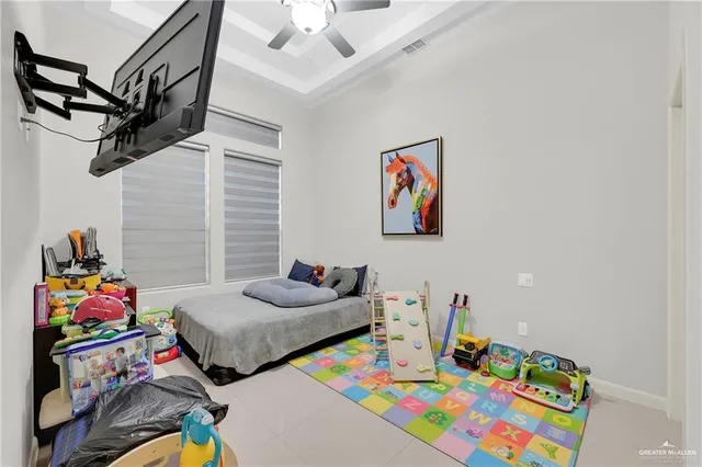 a bedroom with furniture and a baby bed