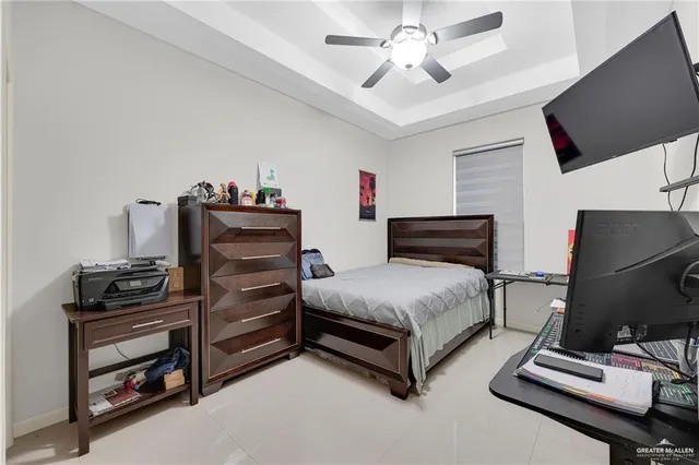 a bedroom with furniture and flat screen tv