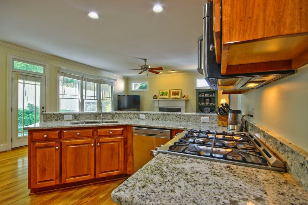 516 Pace Street Raleigh, NC 27604 - Photo 12 of 25 Perfect place for a buffet.Plenty of cabinets and counter space. Note the upgraded granite that these sellers put in (Approx 5K) Kitchen