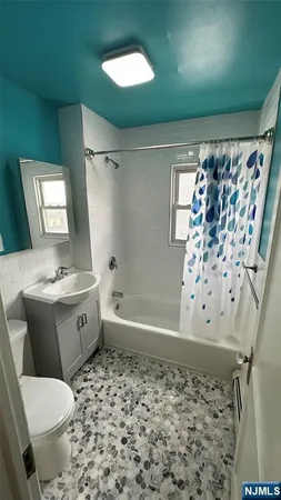 a bathroom with a bathtub sink and toilet