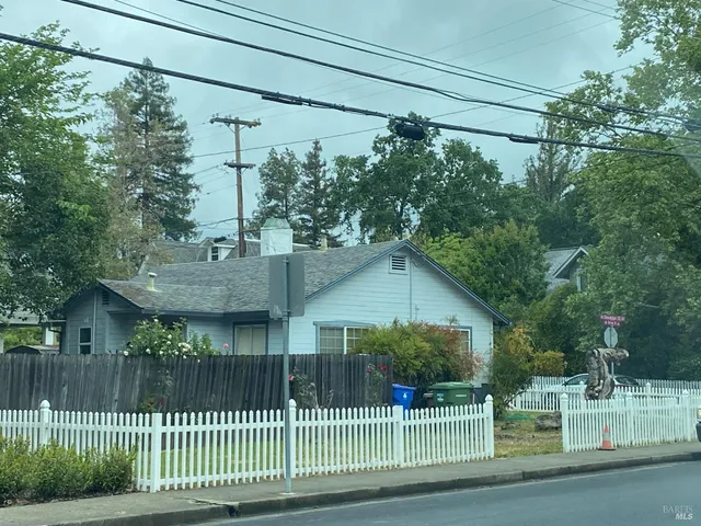 a view of a house and a yard