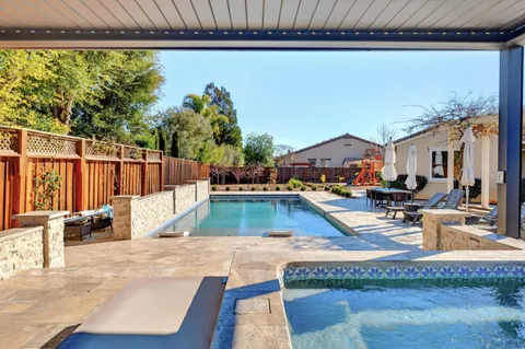 a view of a living room and kitchen