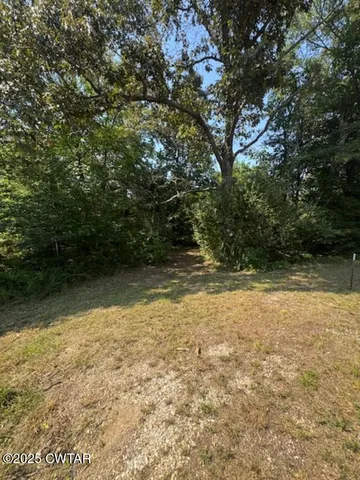 a view of a patio with a yard