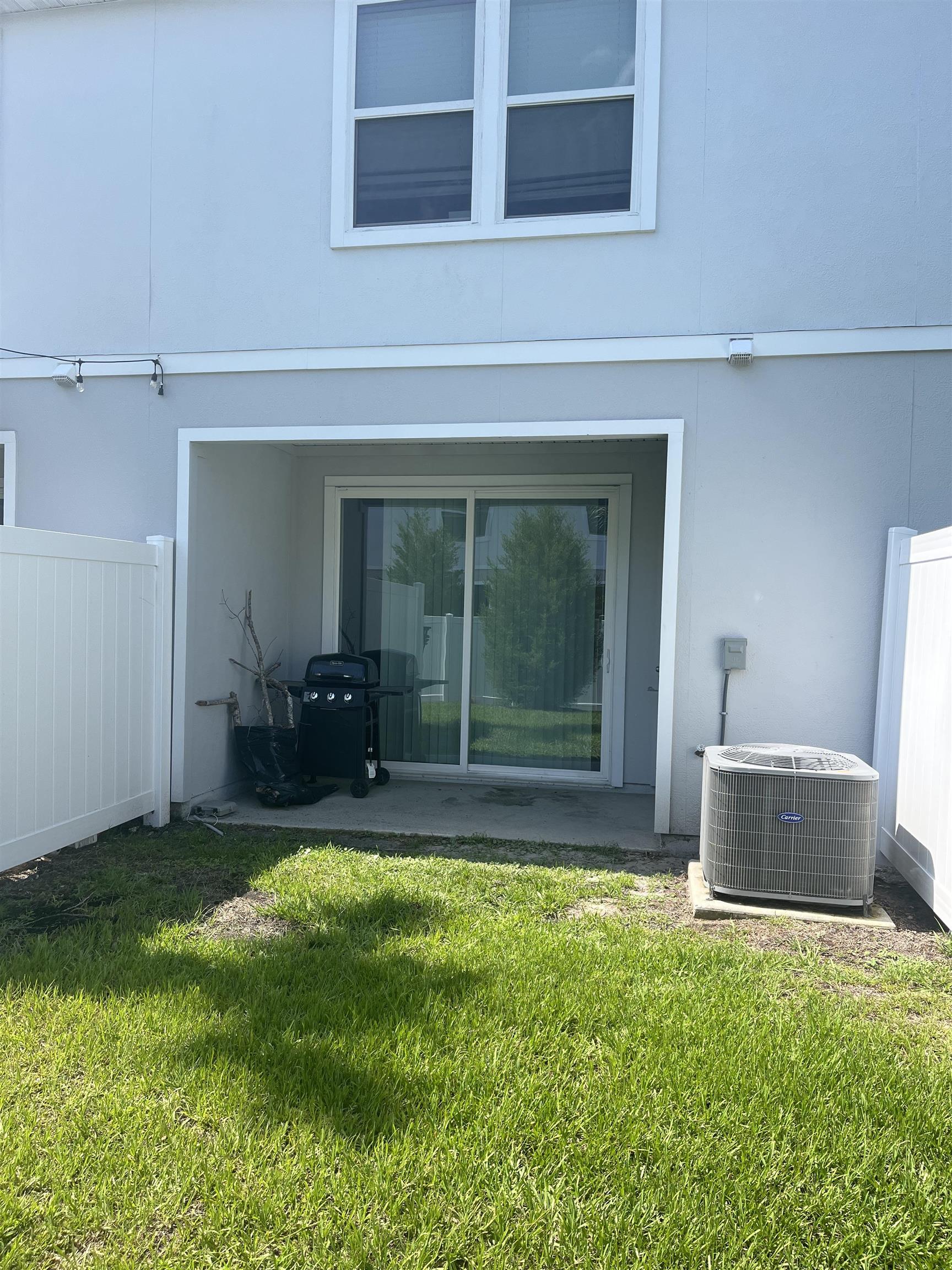 102 Vidalia Ridge Rd Street St. Augustine, FL 32084 - Photo 21 of 29 a view of a backyard with a garden and plants