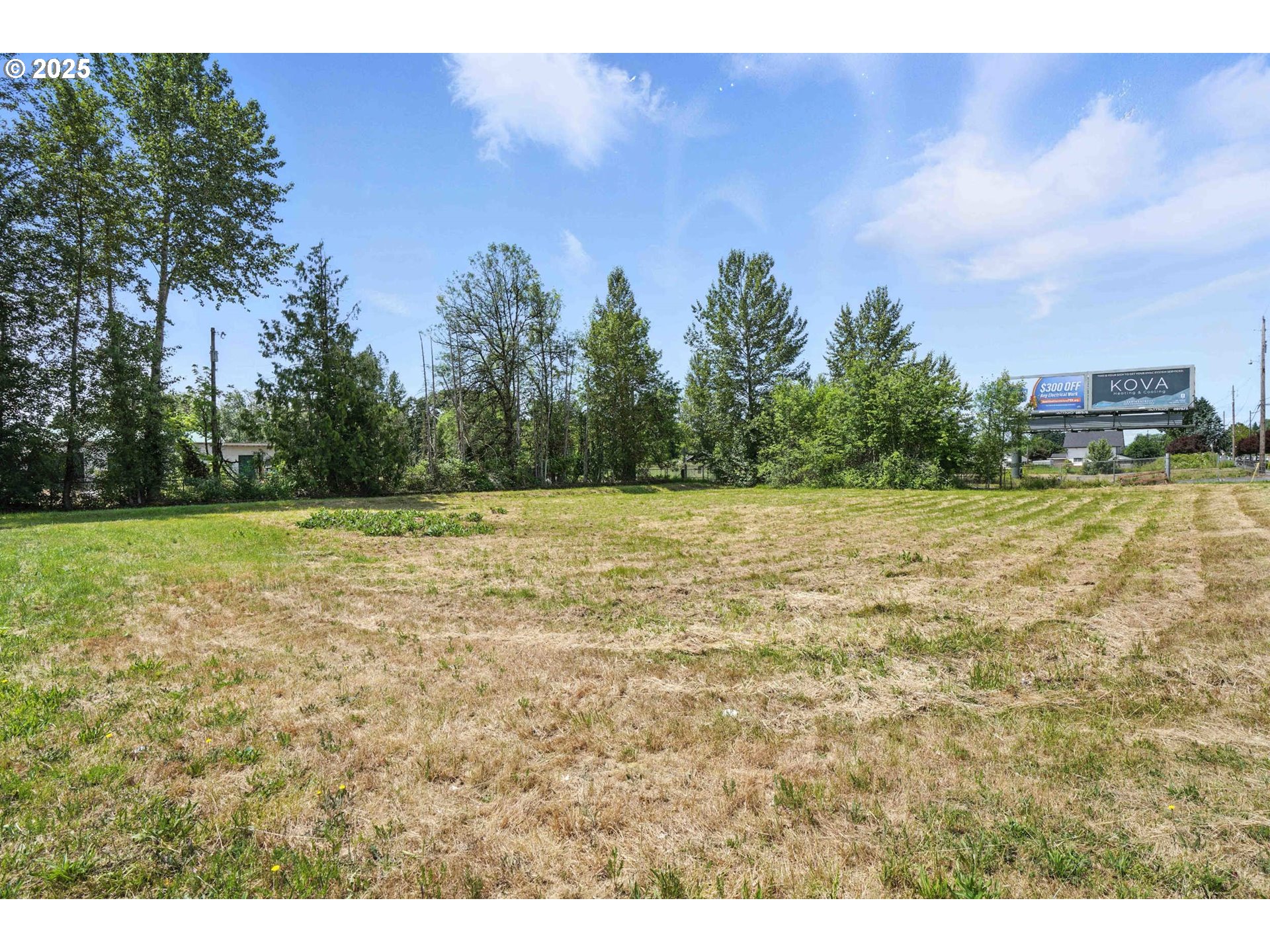West Main Street Battle Ground, WA 98604 - Photo 1 of 16 a view of a field with trees in the background
