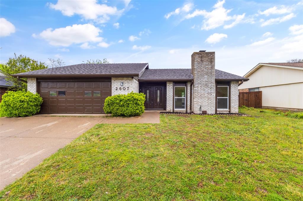 2607 Treeview Drive Arlington, TX 76016 - Photo 1 of 1 a front view of a house with a garden