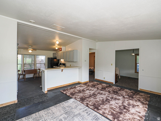 94 Spring Canyon Road Coalville, UT 84017 - Photo 30 of 50 Open-concept living space featuring a partial wall separating the kitchen area