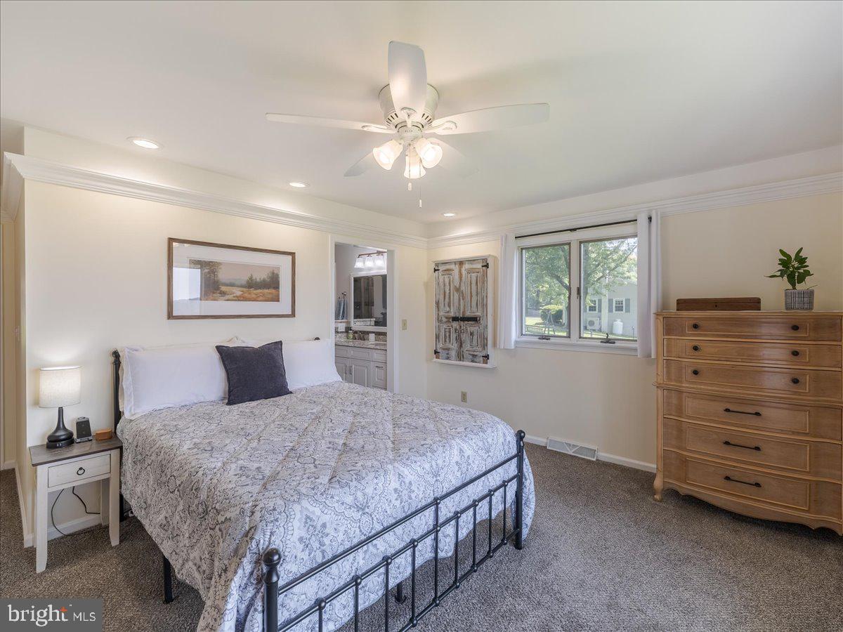 102 Upper Valley Road Christiana, PA 17509 - Photo 21 of 75 a bedroom with a large bed and a chandelier