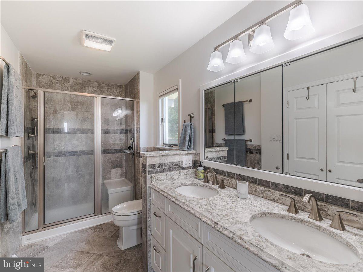 102 Upper Valley Road Christiana, PA 17509 - Photo 22 of 75 a bathroom with a granite countertop sink toilet and shower