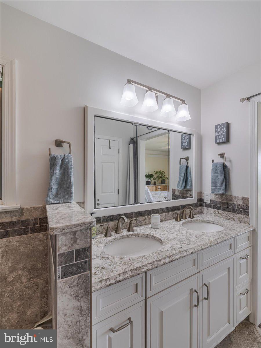 102 Upper Valley Road Christiana, PA 17509 - Photo 23 of 75 a bathroom with a granite countertop sink and a mirror
