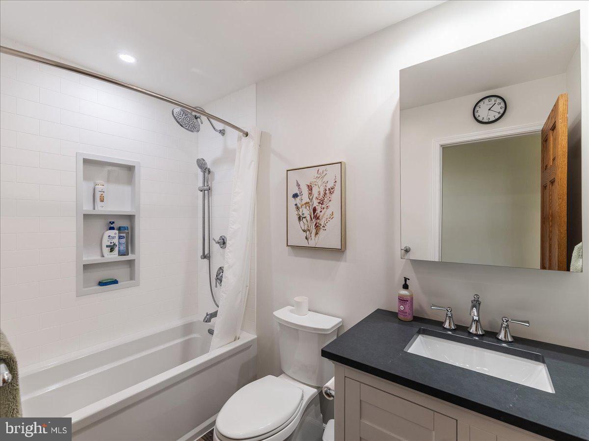 102 Upper Valley Road Christiana, PA 17509 - Photo 25 of 75 a bathroom with a granite countertop sink toilet a mirror a vanity and shower