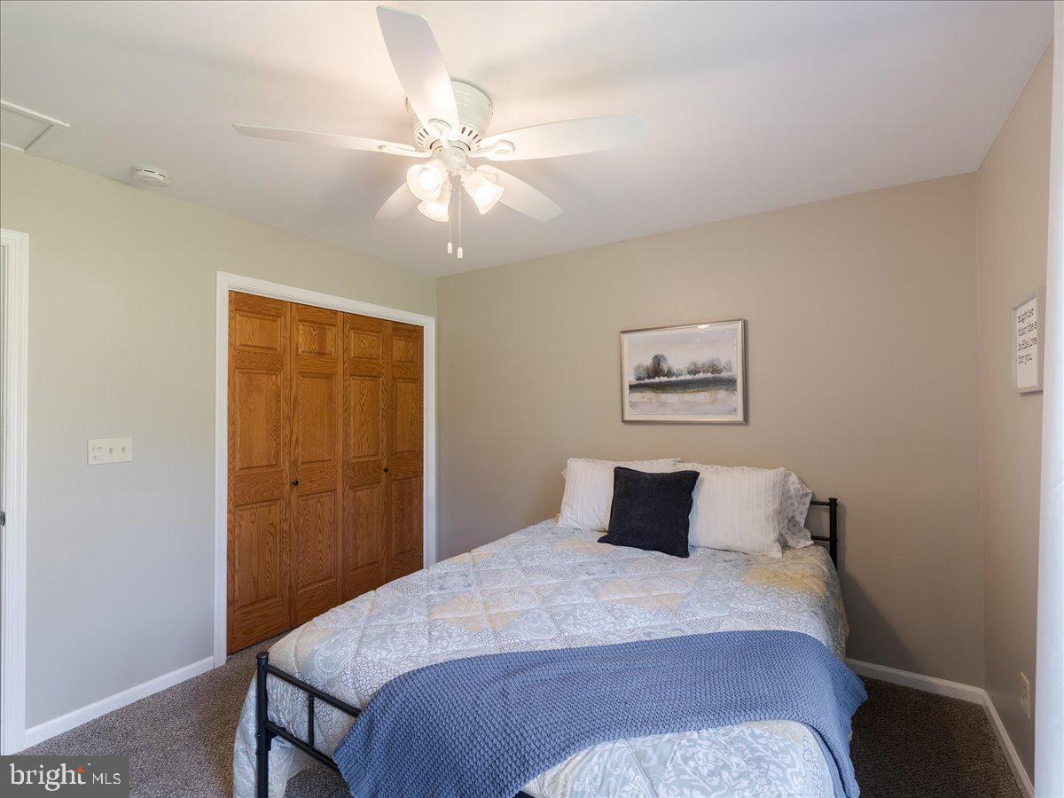 102 Upper Valley Road Christiana, PA 17509 - Photo 28 of 75 a bedroom with a bed and a chandelier