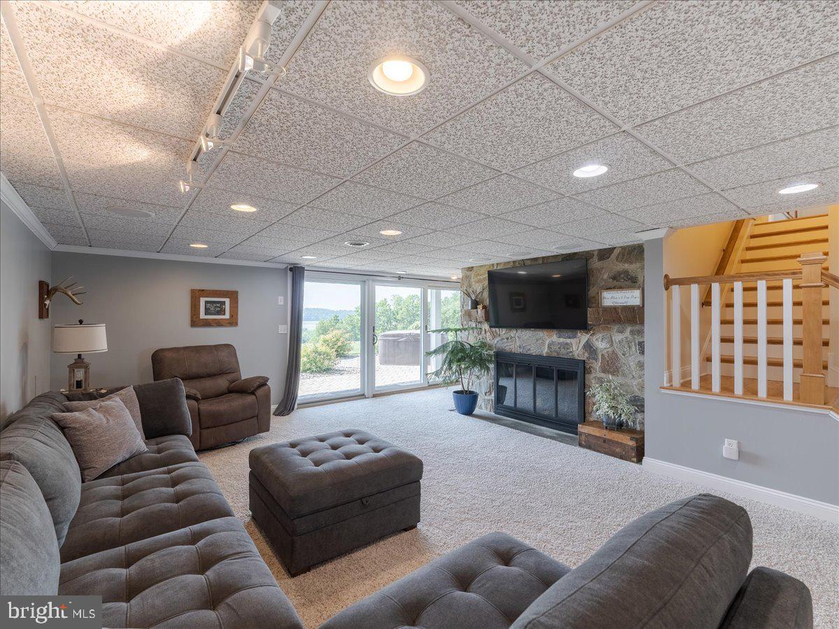 102 Upper Valley Road Christiana, PA 17509 - Photo 42 of 75 a living room with furniture and a flat screen tv